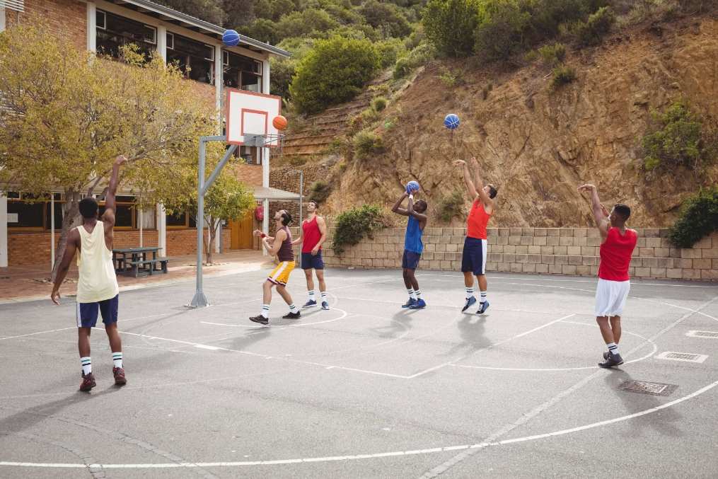 people playing on a basketball court